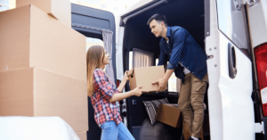 men and women loading a moving truck